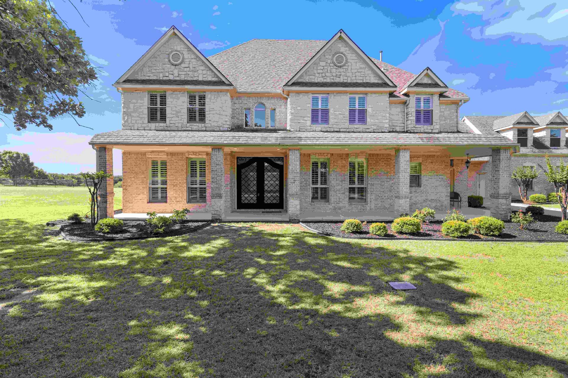 Front exterior of 259 King Ranch Court with covered porch and dual gables