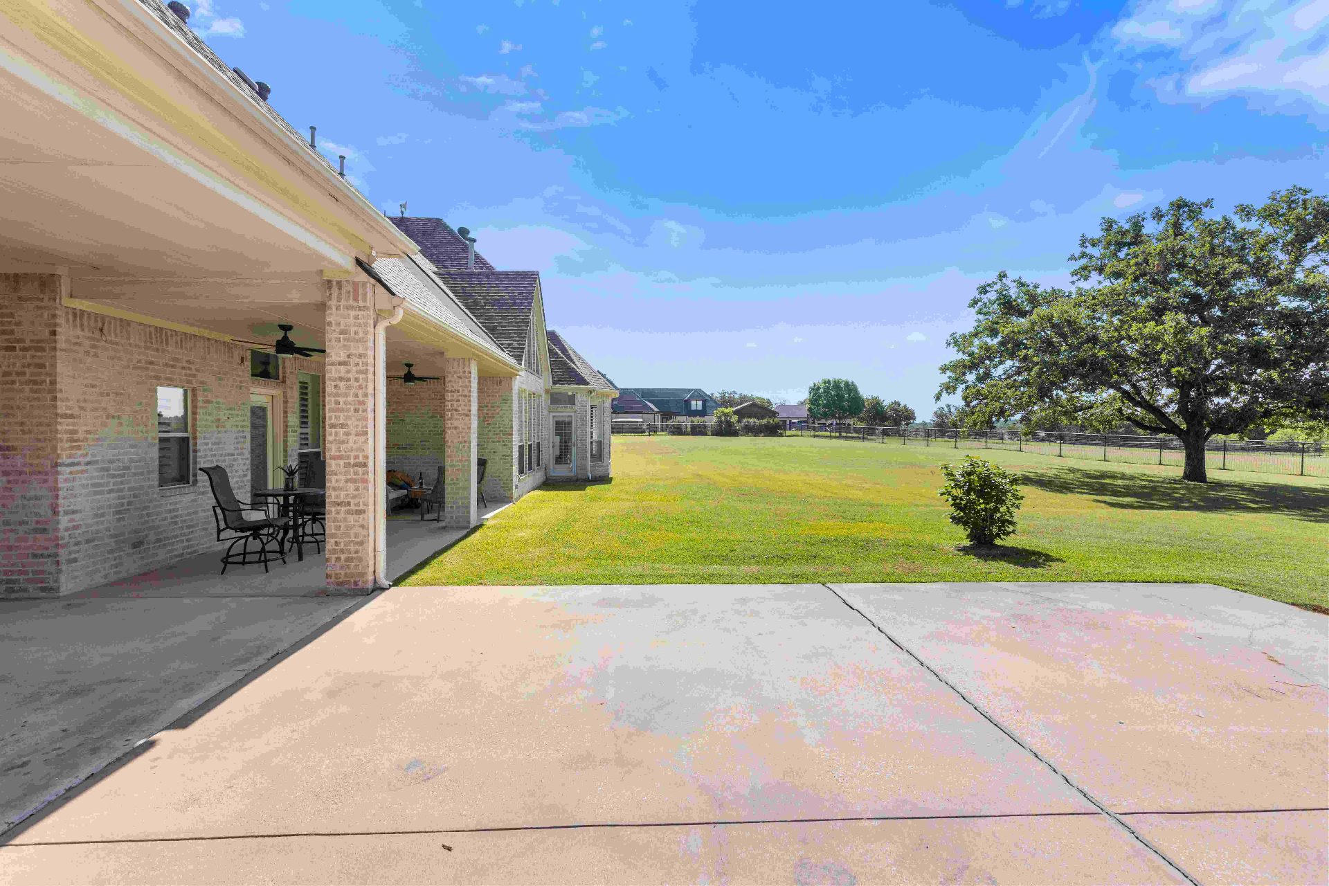 Covered side patio overlooking the open pasture