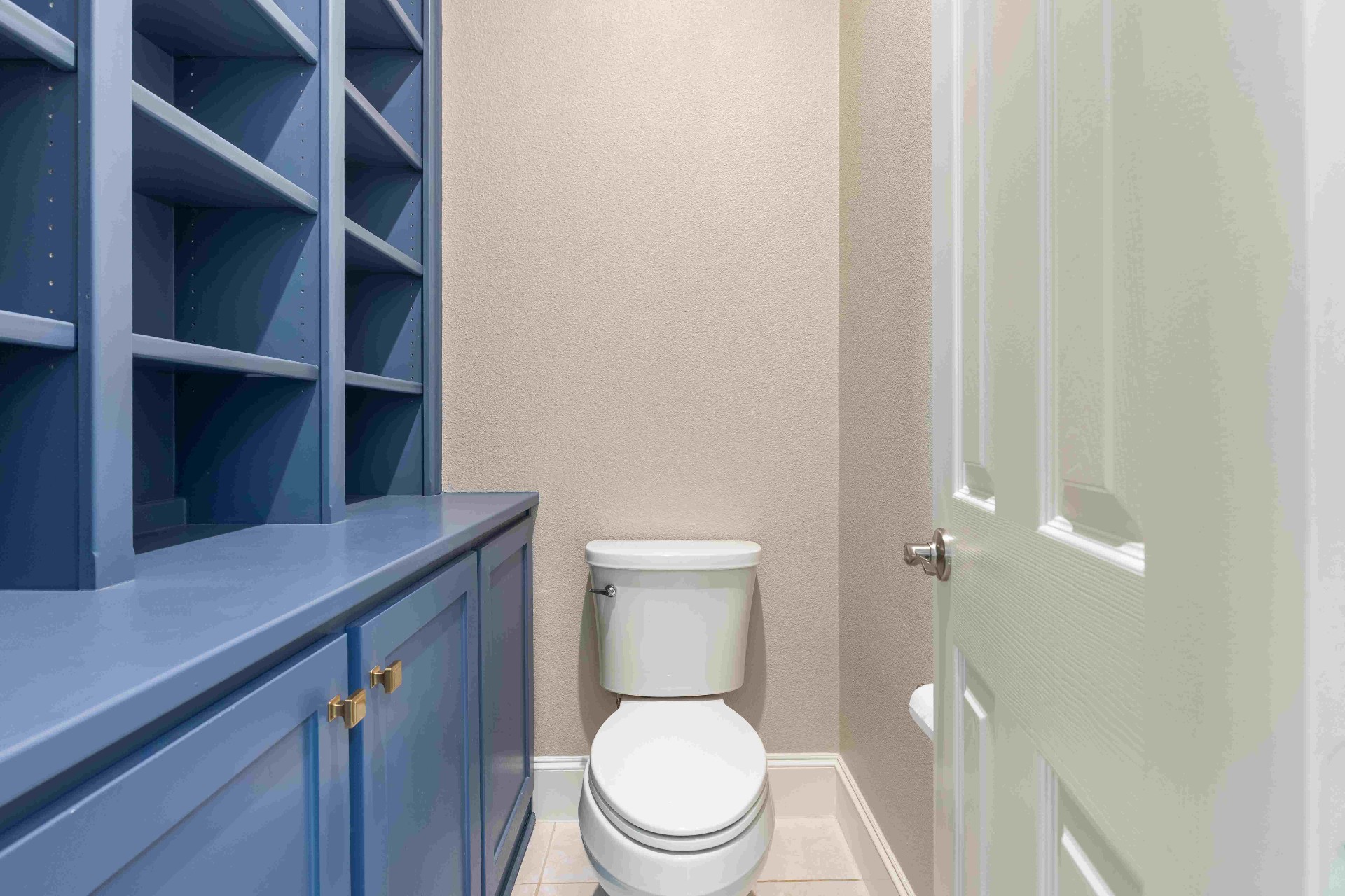Private water closet with built-in linen storage