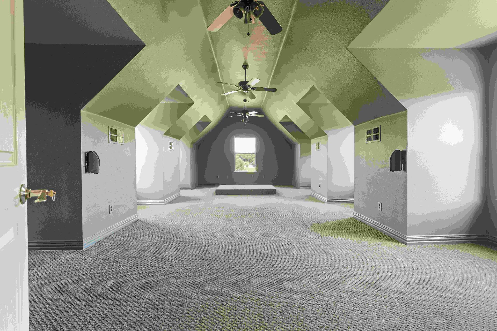 Expansive upstairs bonus room with vaulted ceiling and dormer windows