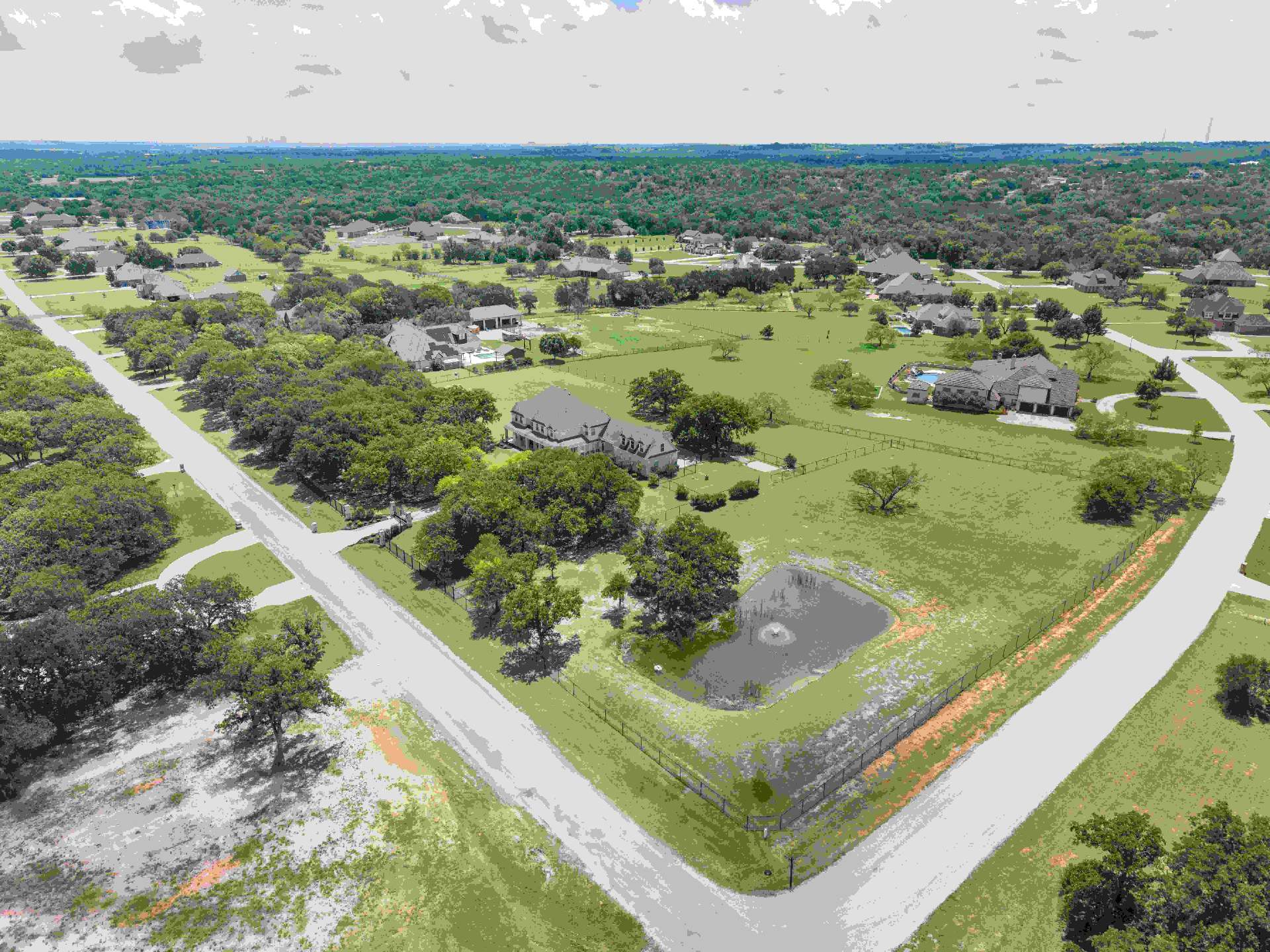 Aerial view of 259 King Ranch Court showing the 3.63-acre lot and tank