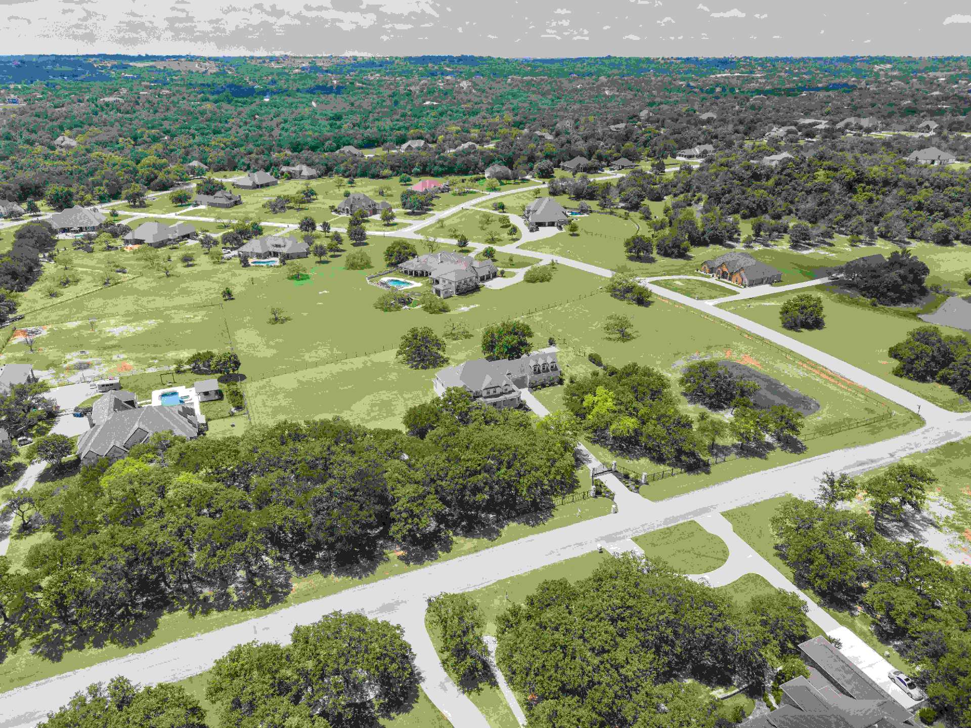 Aerial view of King Ranch Estates with the property and gated entry