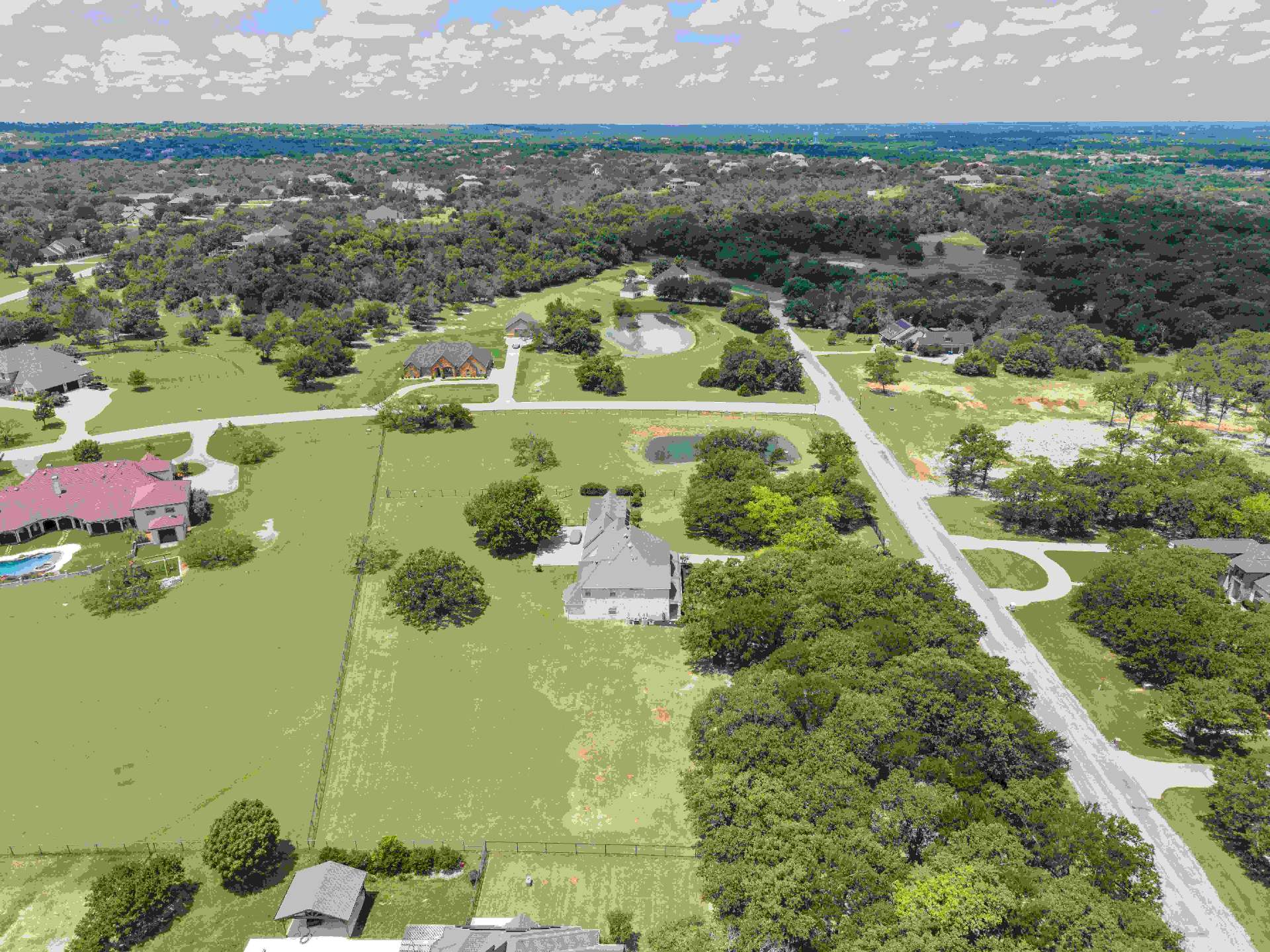 Aerial showing mature tree canopy along the property line