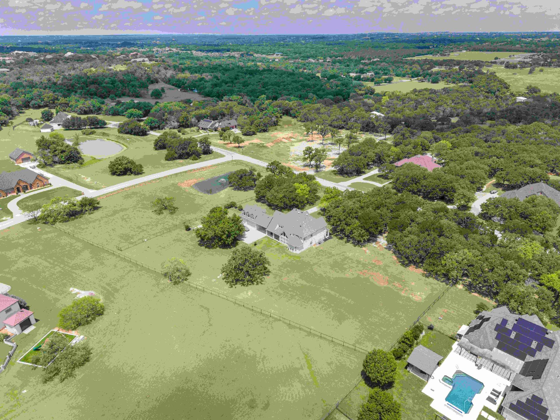Sweeping aerial overview of the 3.63-acre property within King Ranch Estates